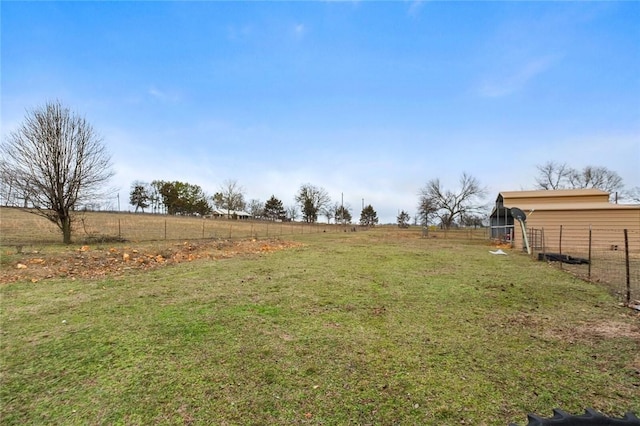 view of yard with a rural view