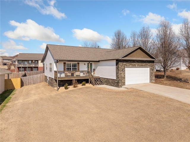 single story home with a garage and a deck