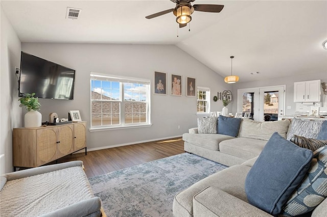 living room with lofted ceiling, dark hardwood / wood-style floors, and ceiling fan