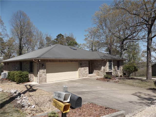 82 Baypoint Dr, Mountain Home, AR 72653 - ranch-style home with central AC, stone siding, metal roof, a garage, and driveway