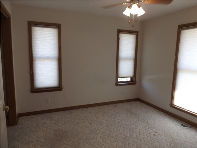 82 Baypoint Dr, Mountain Home, AR 72653 - unfurnished room featuring baseboards, visible vents, ceiling fan, and plenty of natural light