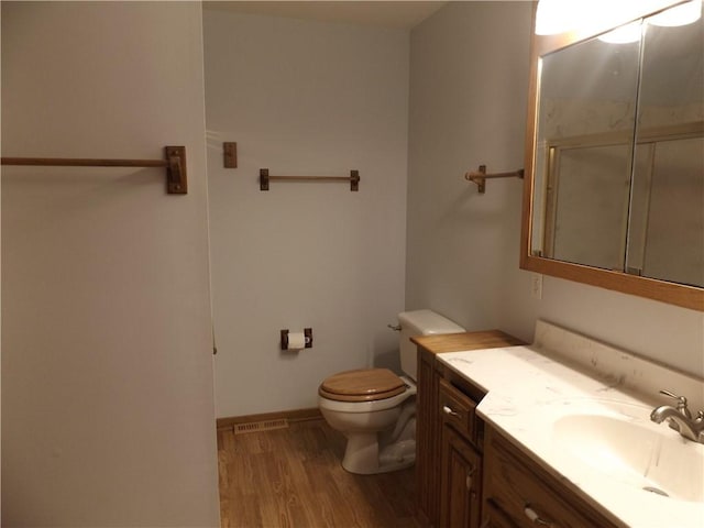 82 Baypoint Dr, Mountain Home, AR 72653 - full bath with vanity, toilet, visible vents, a shower with shower door, and wood finished floors