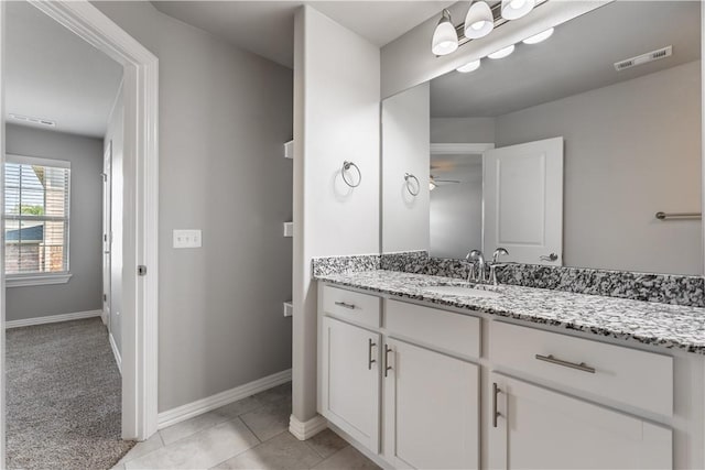 2643 S Kilimanjaro Way, Rogers, AR 72758 - bathroom with vanity, a ceiling fan, and tile patterned flooring