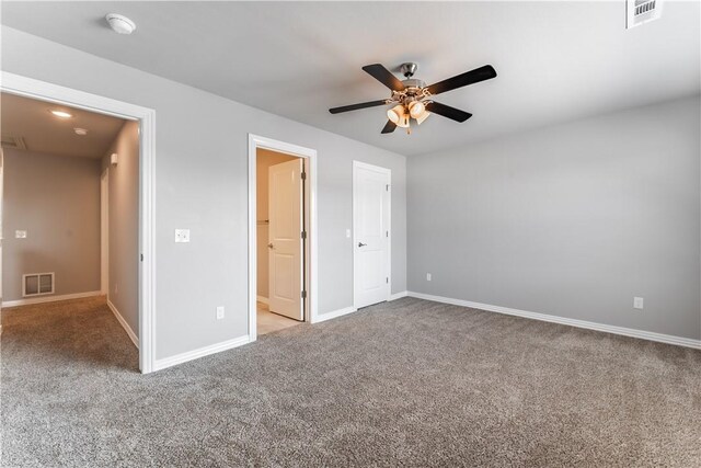 2643 S Kilimanjaro Way, Rogers, AR 72758 - unfurnished bedroom featuring carpet floors and ceiling fan