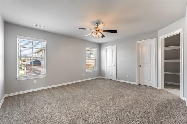 2643 S Kilimanjaro Way, Rogers, AR 72758 - unfurnished bedroom with carpet flooring and ceiling fan
