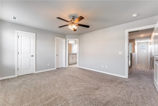 2643 S Kilimanjaro Way, Rogers, AR 72758 - unfurnished bedroom featuring light carpet, connected bathroom, and a ceiling fan