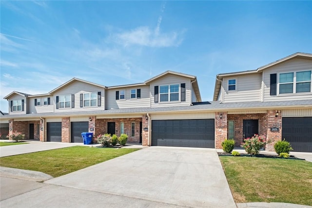 2649 W Everest Ave, Rogers, AR 72758 - multi unit property with a garage, concrete driveway, brick siding, and a front yard