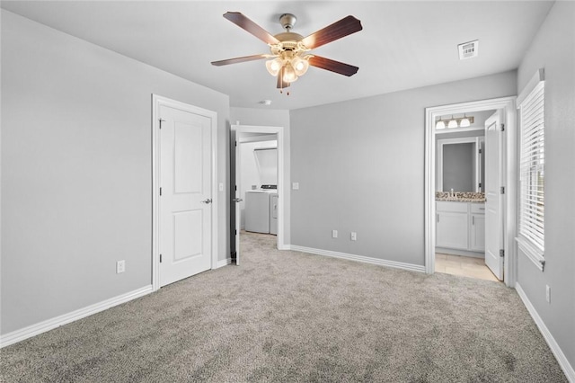 2649 W Everest Ave, Rogers, AR 72758 - unfurnished bedroom with washer / dryer, light carpet, connected bathroom, and ceiling fan