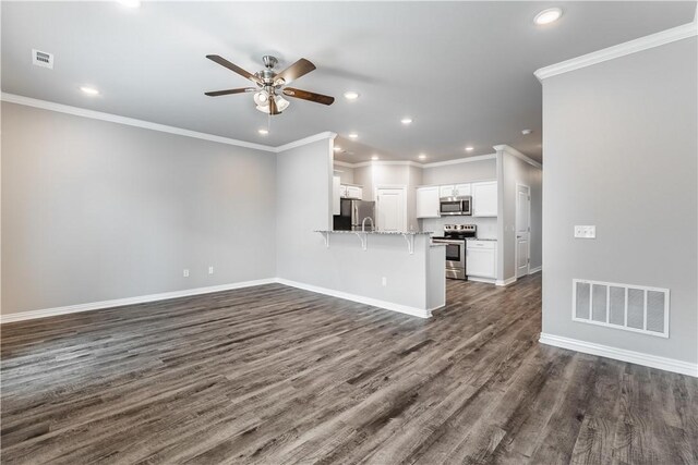 2682 W Kilimanjaro Way, Rogers, AR 72758 - unfurnished living room featuring a ceiling fan, recessed lighting, dark wood finished floors, and crown molding
