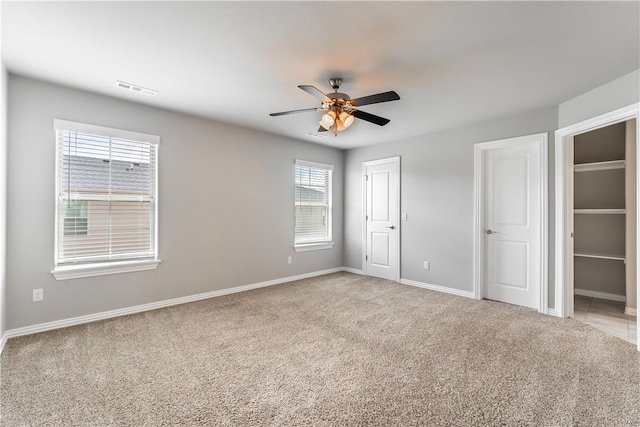2682 W Kilimanjaro Way, Rogers, AR 72758 - unfurnished bedroom featuring light colored carpet and a ceiling fan