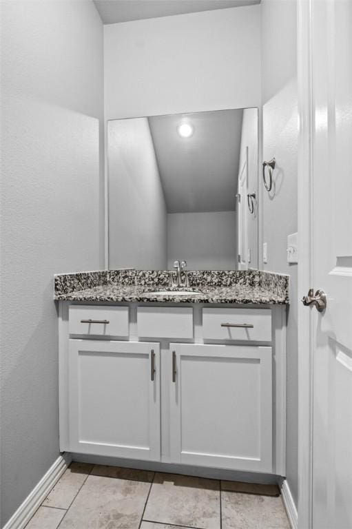 bathroom with vanity and tile patterned floors