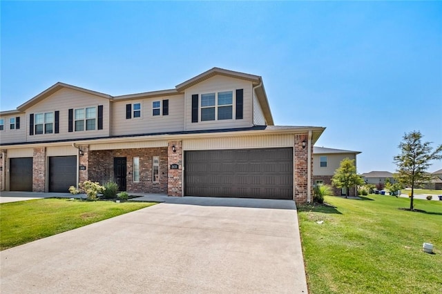 2633 S Kilimanjaro Way, Rogers, AR 72758 - view of front facade with a garage, brick siding, driveway, and a front lawn
