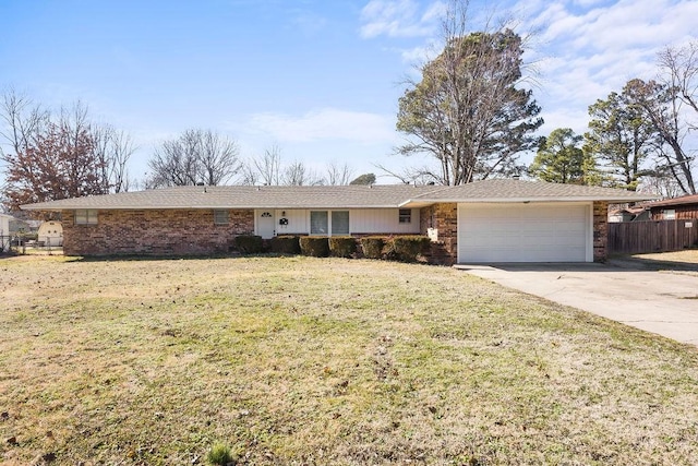ranch-style house featuring an attached garage, driveway, and brick siding