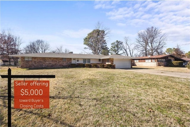 410 S W End St, Springdale, AR 72764 - ranch-style home featuring concrete driveway, a garage, and a front yard