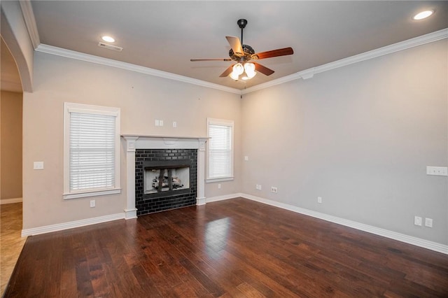 unfurnished living room featuring hardwood / wood-style floors, crown molding, and ceiling fan