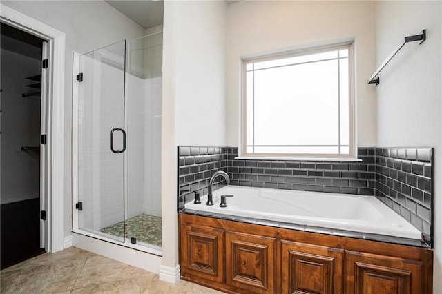 bathroom featuring tile patterned flooring and plus walk in shower