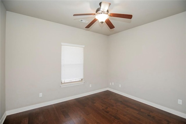 unfurnished room featuring ceiling fan and dark hardwood / wood-style flooring