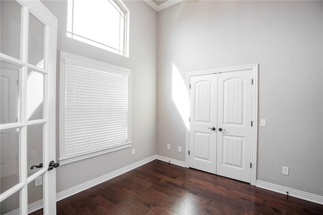 spare room with dark hardwood / wood-style flooring