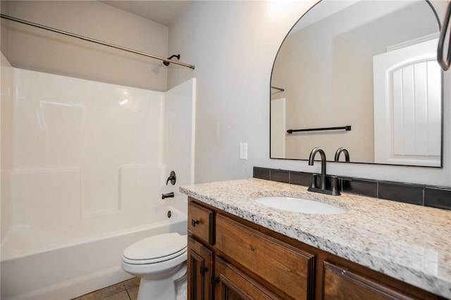 full bathroom with tile patterned floors, vanity, toilet, and shower / bath combination