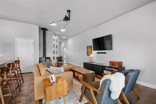 living room featuring a wood stove and light wood-type flooring