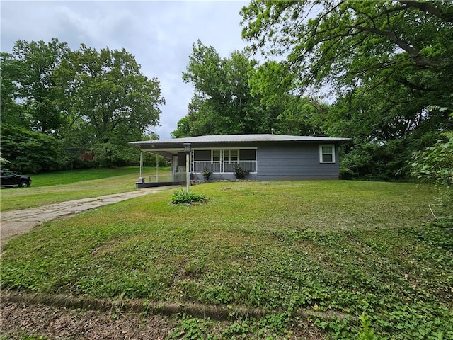708 N Oak St, Harrison, AR 72601 - view of front facade with driveway, a front yard, a carport, and a porch