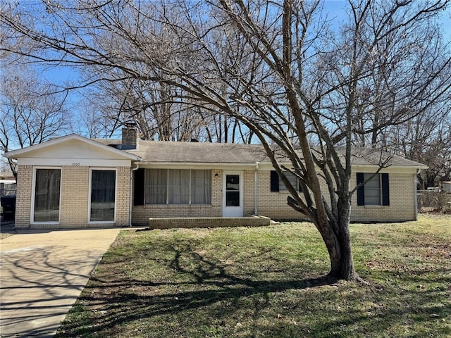 ranch-style house with a front lawn