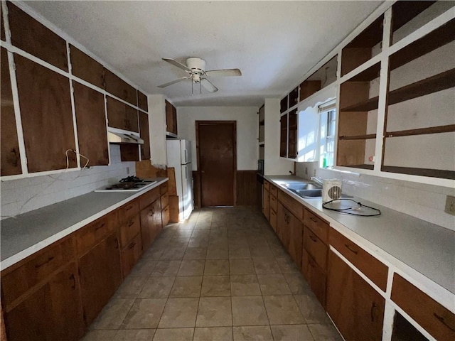 kitchen with sink, white appliances, tasteful backsplash, ceiling fan, and light tile patterned flooring