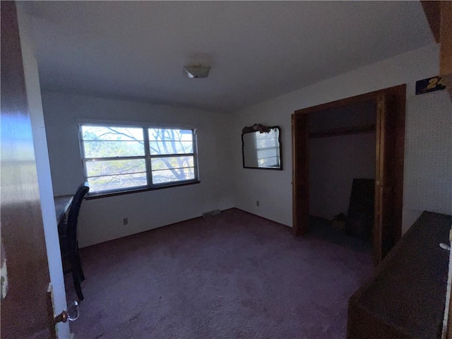 unfurnished bedroom featuring carpet