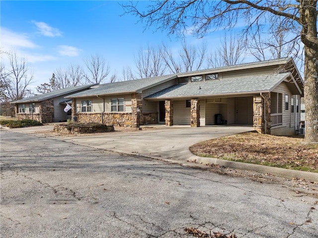 single story home featuring a carport