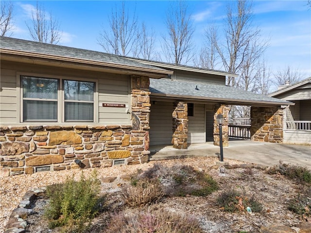 view of front of property with a carport