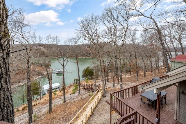 wooden deck featuring a water view