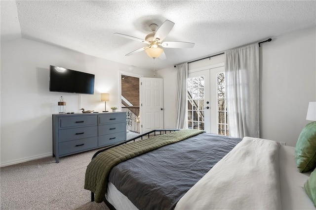 bedroom featuring light carpet, ceiling fan, access to exterior, a textured ceiling, and french doors