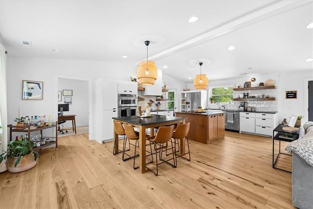 kitchen featuring dark countertops, white cabinetry, and open shelves