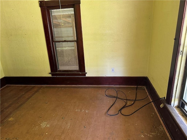 empty room featuring wood-type flooring