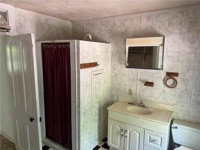 bathroom with toilet, tile walls, a shower with curtain, and vanity