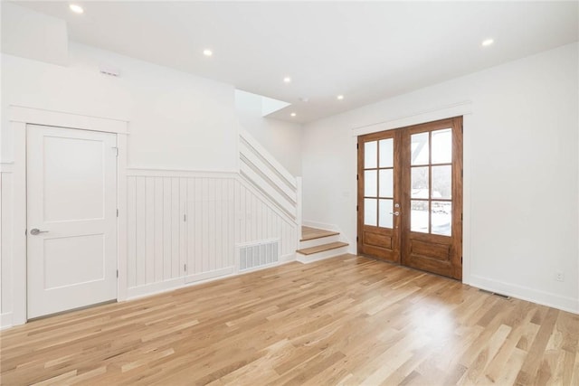 foyer entrance featuring recessed lighting, stairway, visible vents, french doors, and light wood-style floors