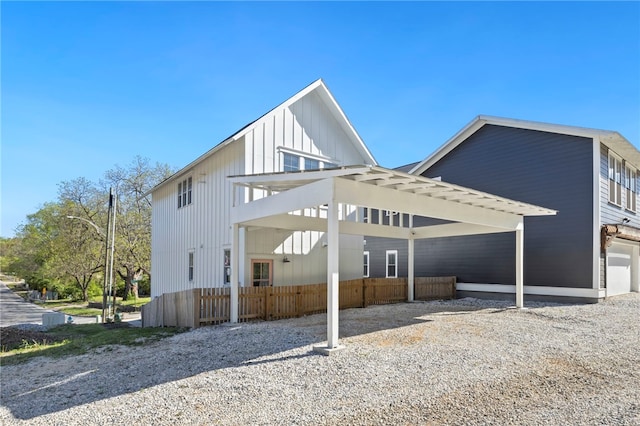 back of house featuring fence
