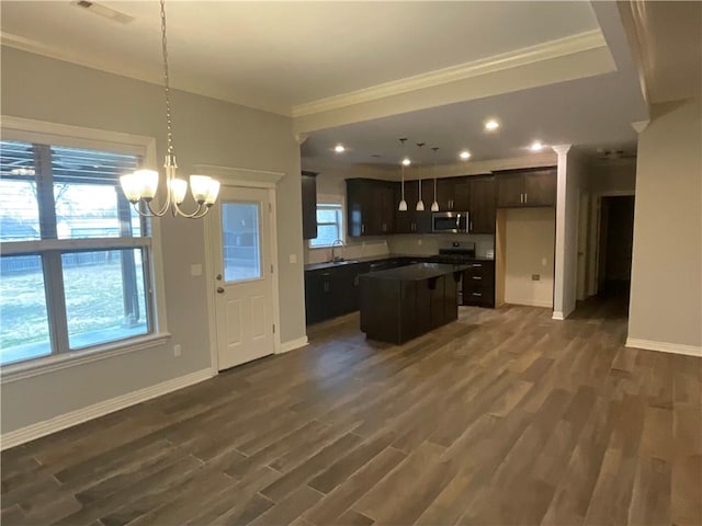 kitchen with pendant lighting, dark hardwood / wood-style floors, and a center island