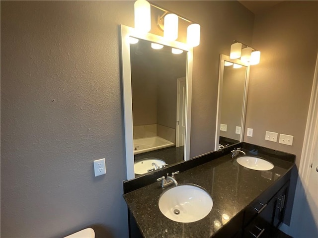 bathroom featuring a tub and vanity