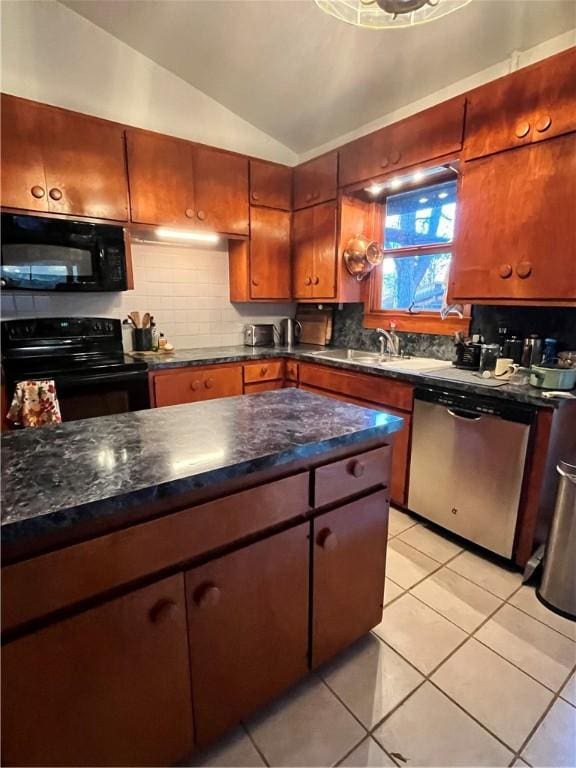 kitchen featuring decorative backsplash, vaulted ceiling, a sink, and black appliances