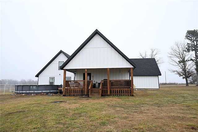 back of house with a yard