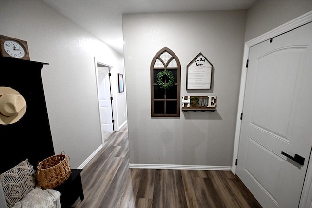 corridor with dark hardwood / wood-style floors