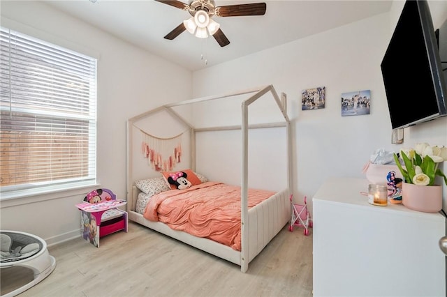 bedroom with light wood-type flooring and ceiling fan