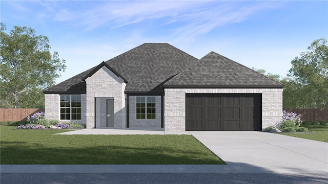 view of front of property with a garage, driveway, roof with shingles, fence, and a front yard