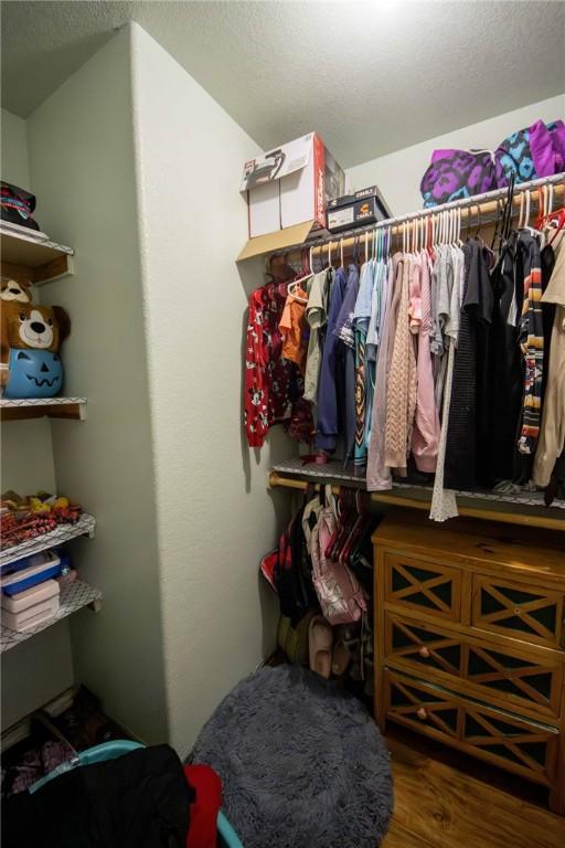 9998 Farm Rd Unit 2240, Washburn, MO 65772 - spacious closet featuring wood finished floors
