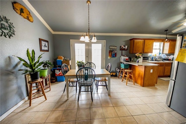 9998 Farm Rd Unit 2240, Washburn, MO 65772 - dining space featuring light tile patterned floors, a toaster, ornamental molding, and ceiling fan with notable chandelier