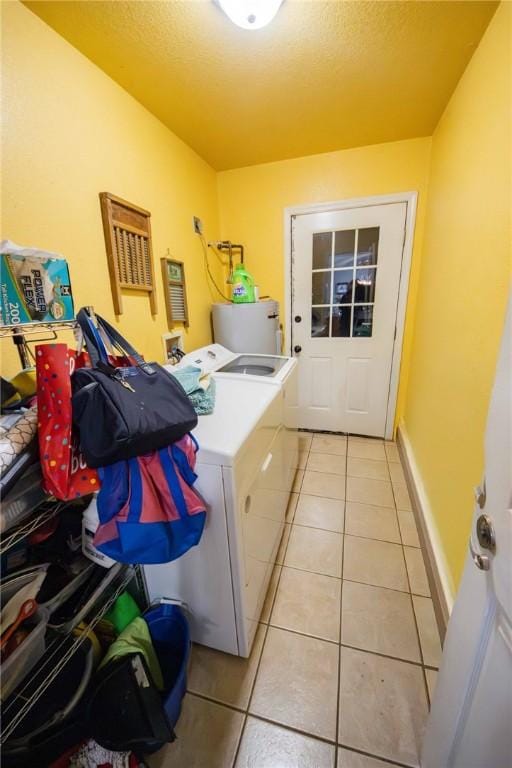 9998 Farm Rd Unit 2240, Washburn, MO 65772 - washroom featuring light tile patterned flooring, laundry area, washing machine and dryer, and a textured ceiling
