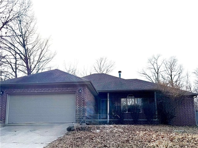 ranch-style home featuring a garage