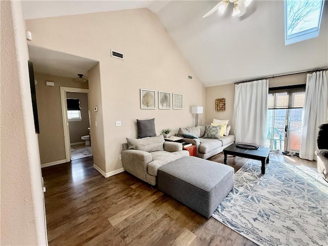 living room featuring hardwood / wood-style floors, high vaulted ceiling, and ceiling fan