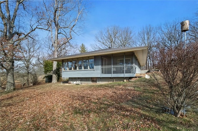 view of front facade featuring a sunroom